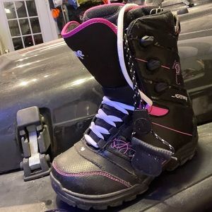 Woman’s pink snowboarding boots.